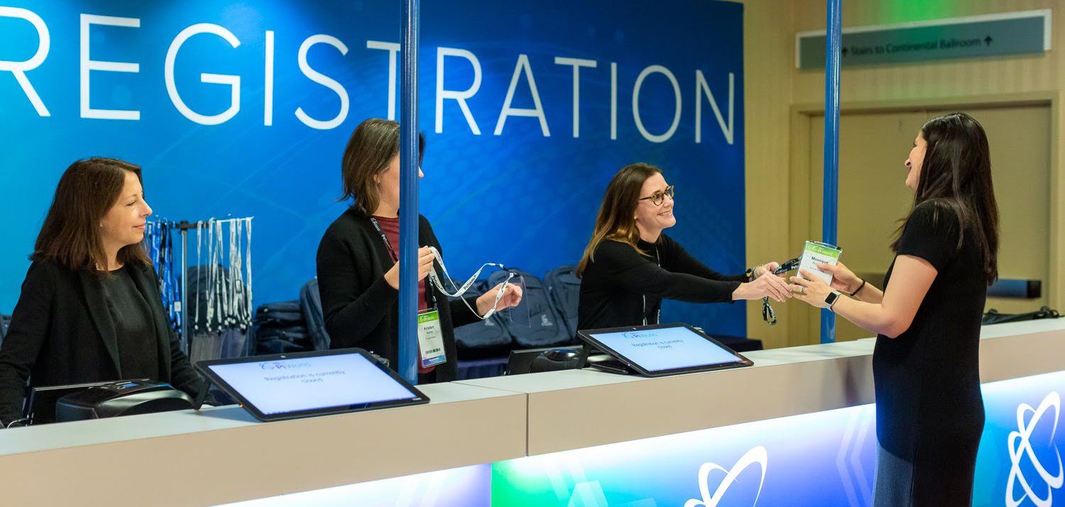 A vibrant urban landscape showcasing modern architecture with green spaces and people engaging in various activities. The scene conveys a sense of community and liveliness, highlighting the integration of nature within the urban environment.